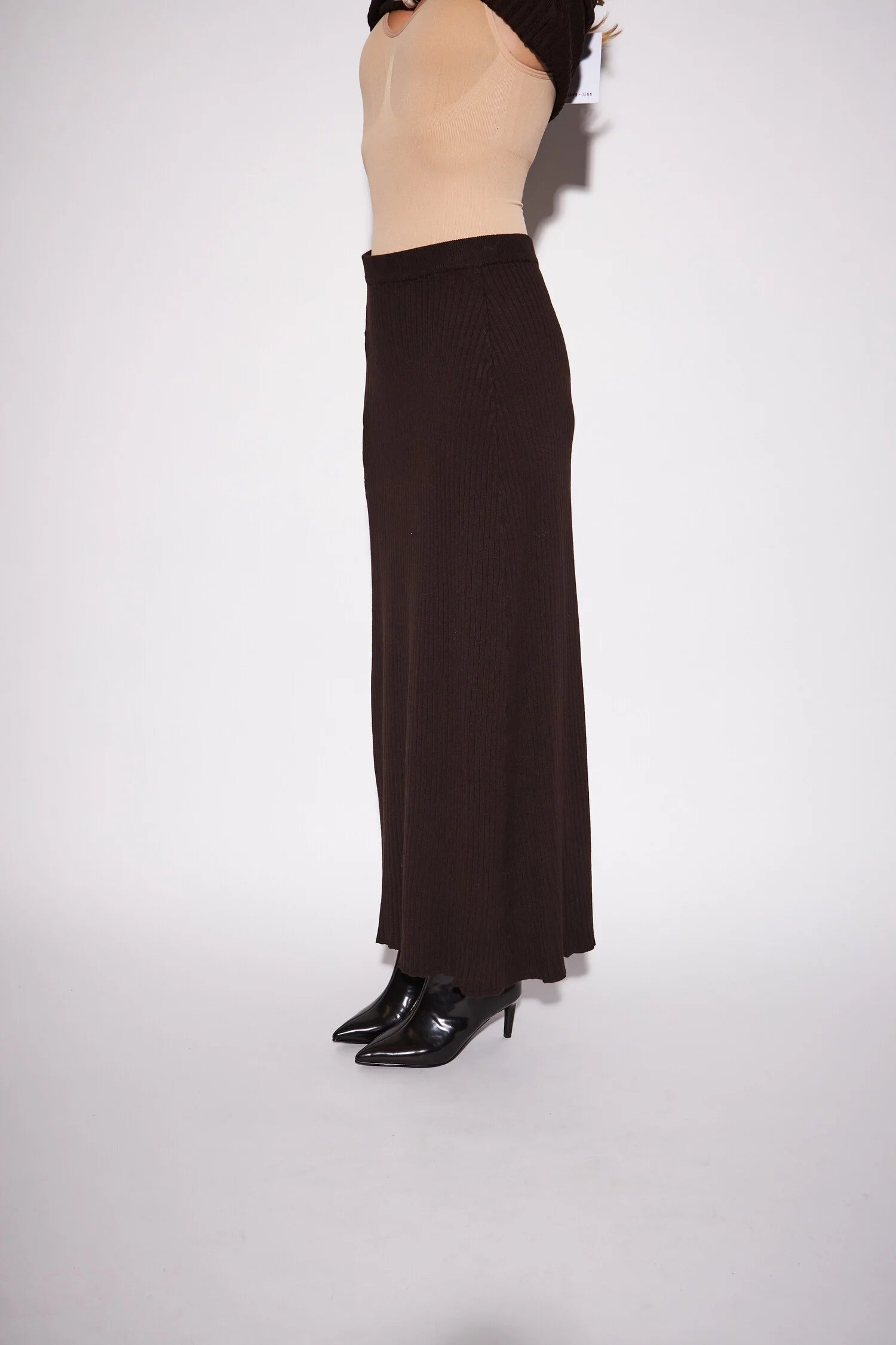 Gia Knit Skirt featuring a sleek, close-fitting silhouette and streamlined column shape for an elegant, minimalist look.
