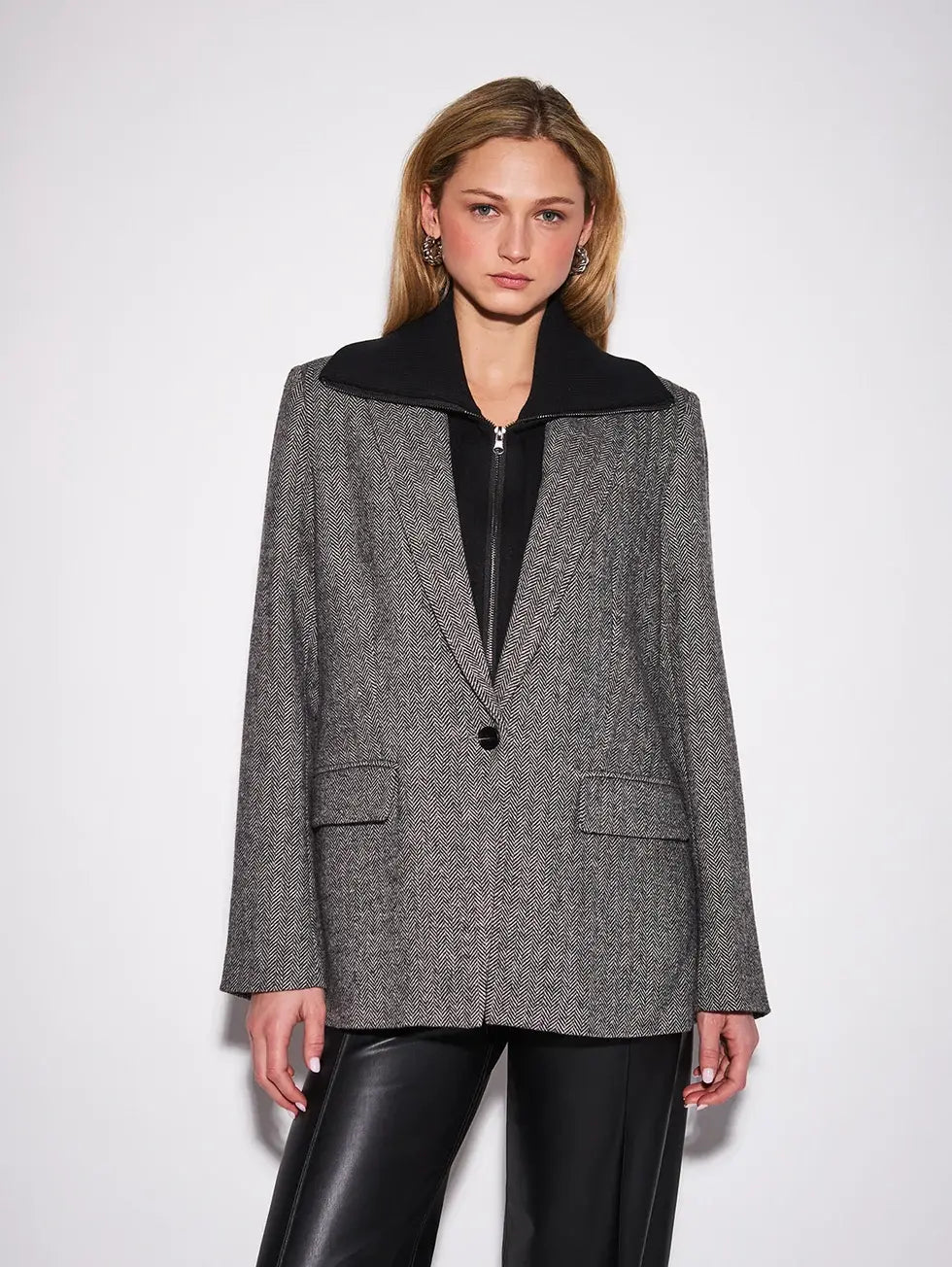 John & Jenn Hayes Blazer featuring a classic herringbone pattern, structured fit, elongated silhouette, and subtle texture for a polished, menswear-inspired look.