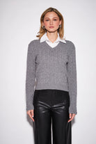 John & Jenn Renn Cable-Knit Sweater featuring a classic textured cable-knit design and contrasting collar for a preppy, collegiate-inspired look with timeless appeal.