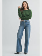 woman wearing a medium wash wide leg jean with a 33 inch inseam