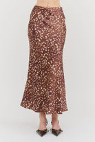 Kalila Midi Skirt in soft brown featuring a white deer print, flattering mermaid silhouette, and flowing ankle-length hem.