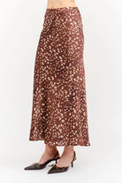 Kalila Midi Skirt in soft brown featuring a white deer print, flattering mermaid silhouette, and flowing ankle-length hem.