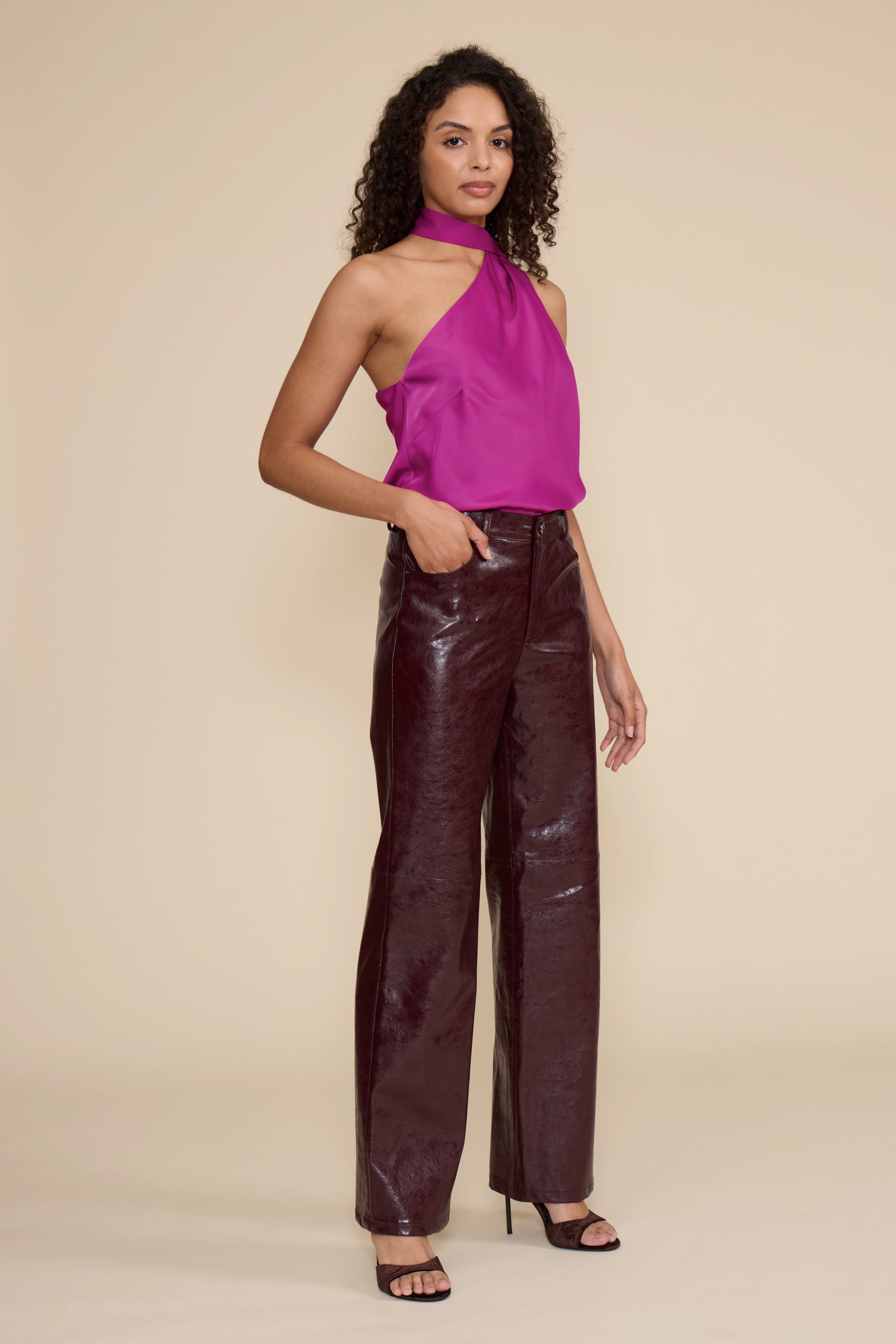 Cleo Faux Leather Pant in wine featuring a high-rise waist, straight-leg fit, and glossy faux leather finish.