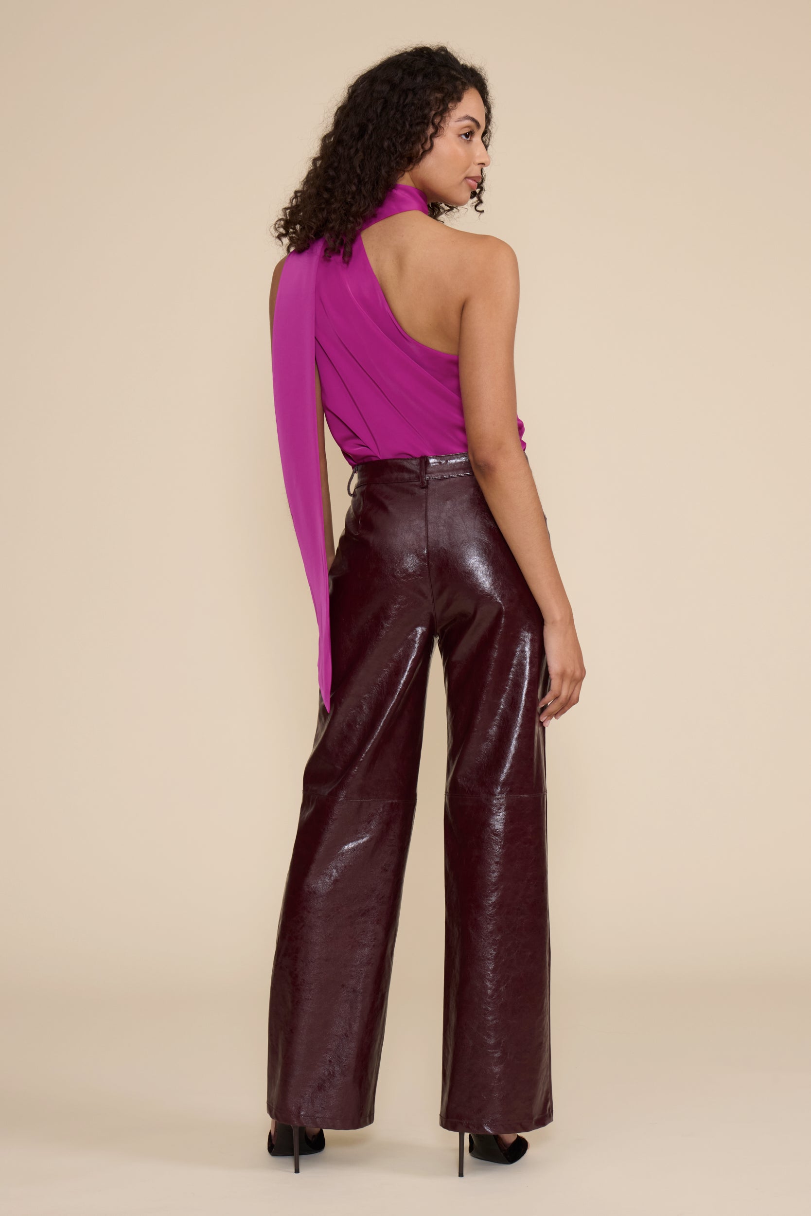 Cleo Faux Leather Pant in wine featuring a high-rise waist, straight-leg fit, and glossy faux leather finish.