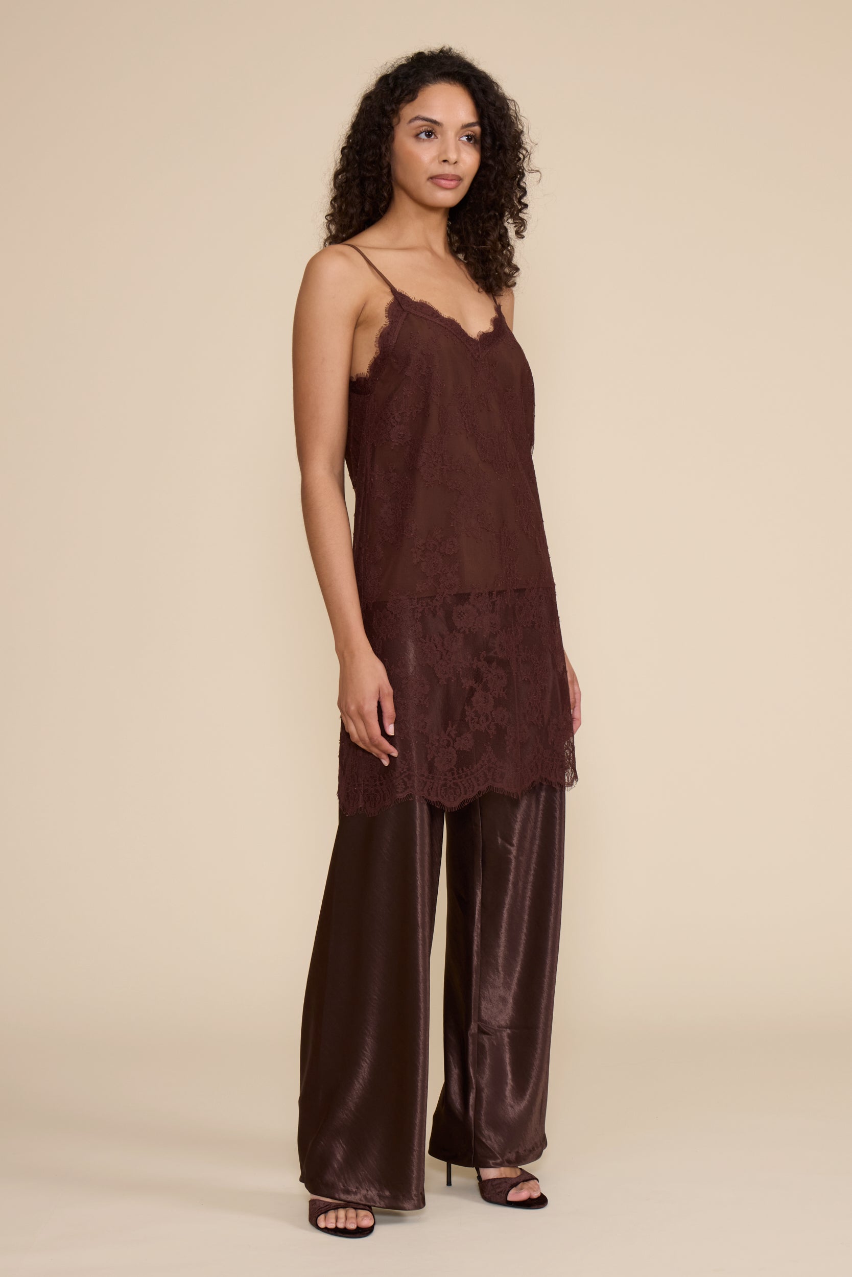 Gabrielle Lace Top in brown featuring all-over floral lace, slim spaghetti straps, a V-neckline, and relaxed silhouette.