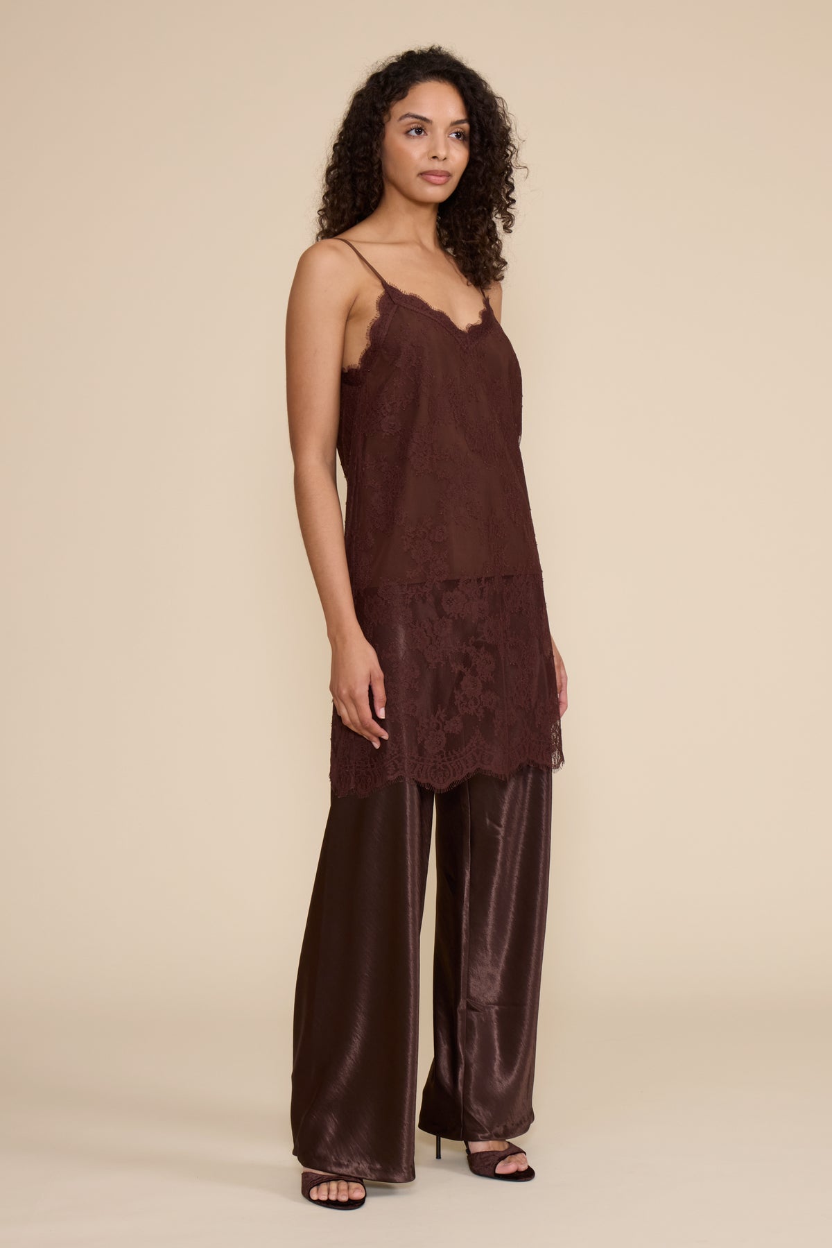 Gabrielle Lace Top in brown featuring all-over floral lace, slim spaghetti straps, a V-neckline, and relaxed silhouette.