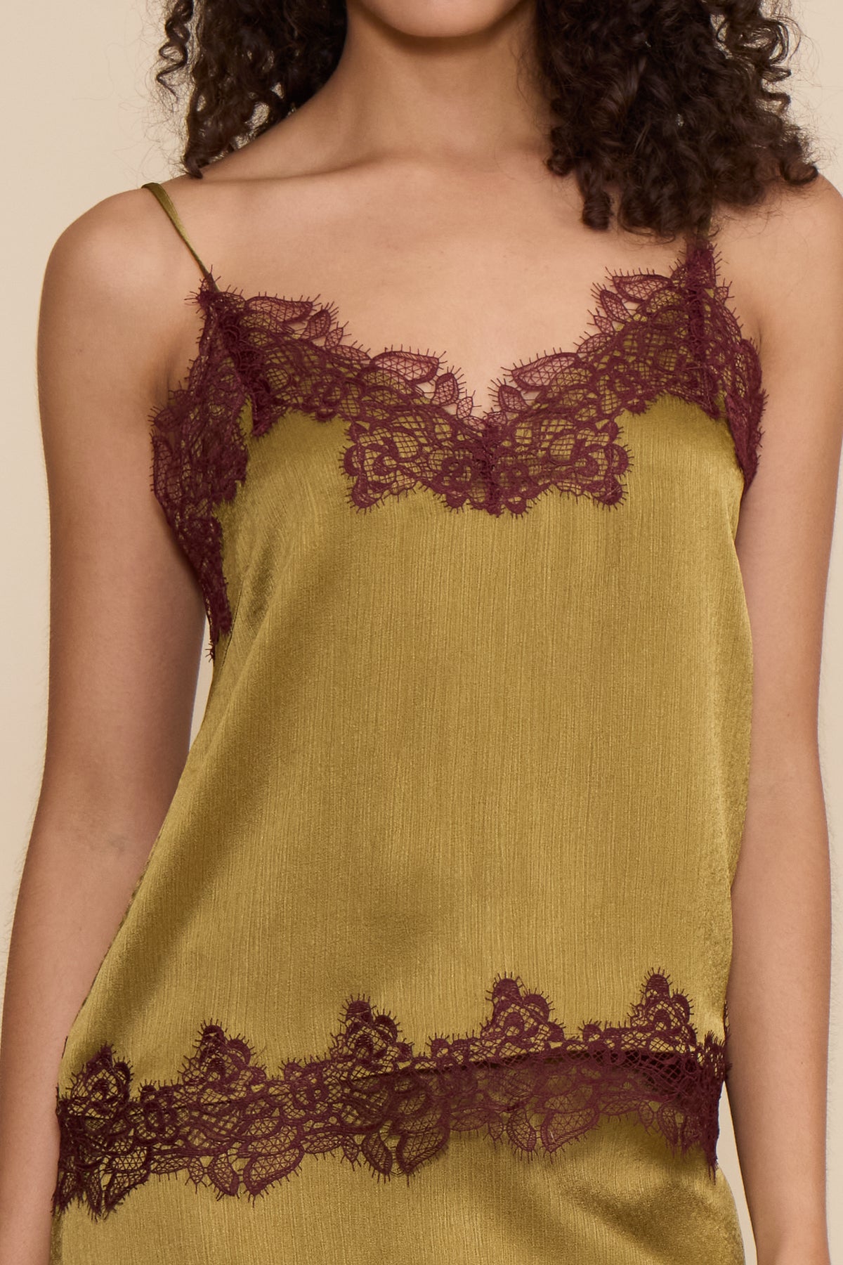 Vanessa Satin Lace Top in chartreuse featuring a satin finish, slim spaghetti straps, V-neckline, and burgundy contrast lace trim.