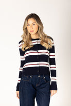 Lightweight ribbed knit cardigan in a navy base with white, brick red, and grey stripes, featuring a classic silhouette and button-front closure for easy layering.