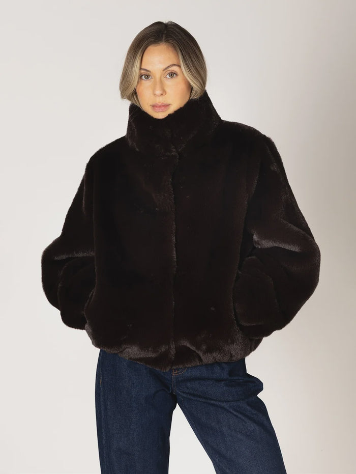 Kendra Short Faux Fur Coat in espresso brown featuring a soft, plush faux fur texture, relaxed fit, cropped silhouette, crew neckline, long sleeves, and front button closure.