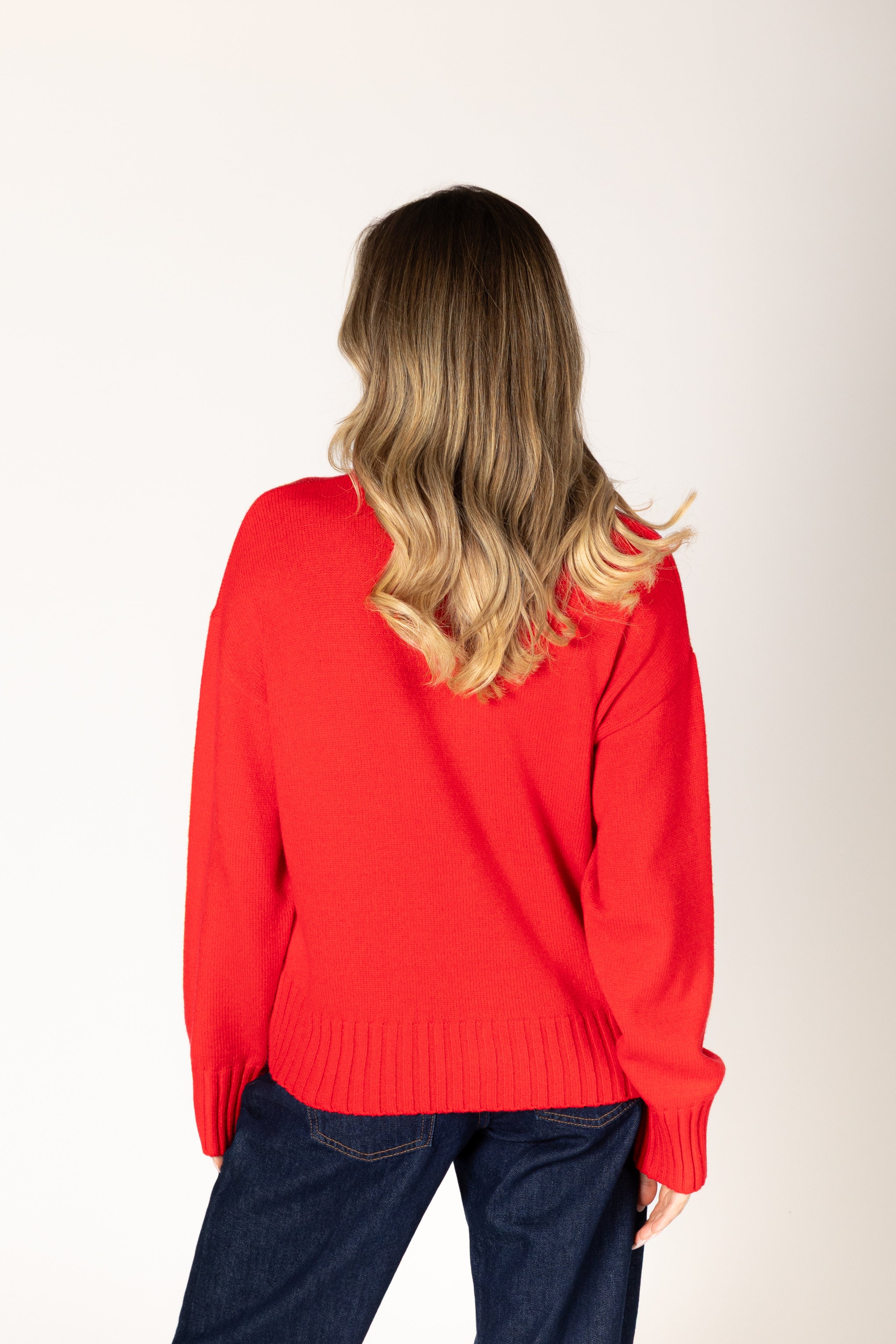 Neutral knit cardigan featuring a classic crew neckline, button-front closure, and ribbed detailing for a timeless, polished look.
