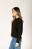 Olive crewneck sweater in a soft knit, featuring a classic silhouette and ribbed trim at the cuffs and hem.
