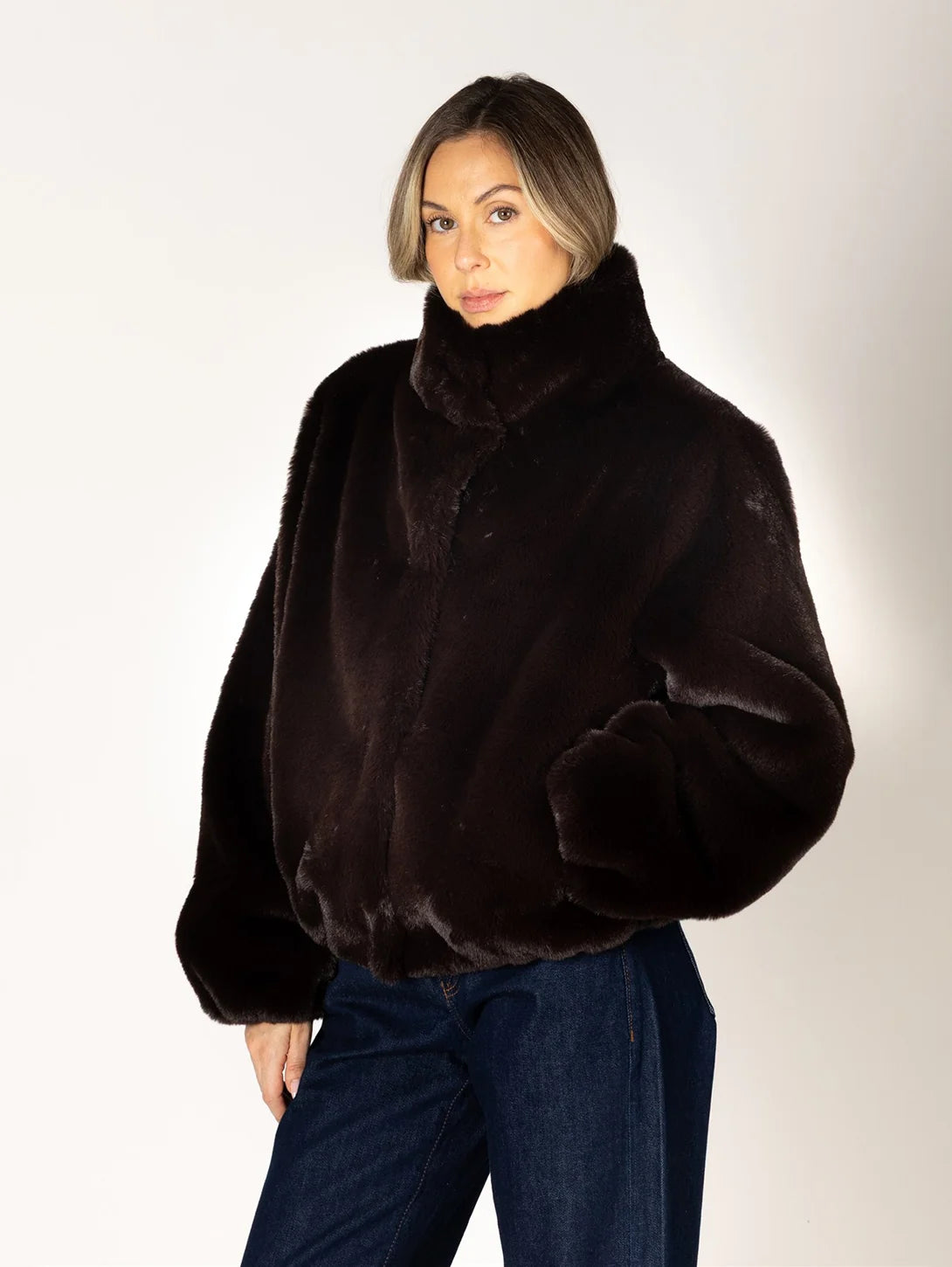 Kendra Short Faux Fur Coat in espresso brown featuring a soft, plush faux fur texture, relaxed fit, cropped silhouette, crew neckline, long sleeves, and front button closure.