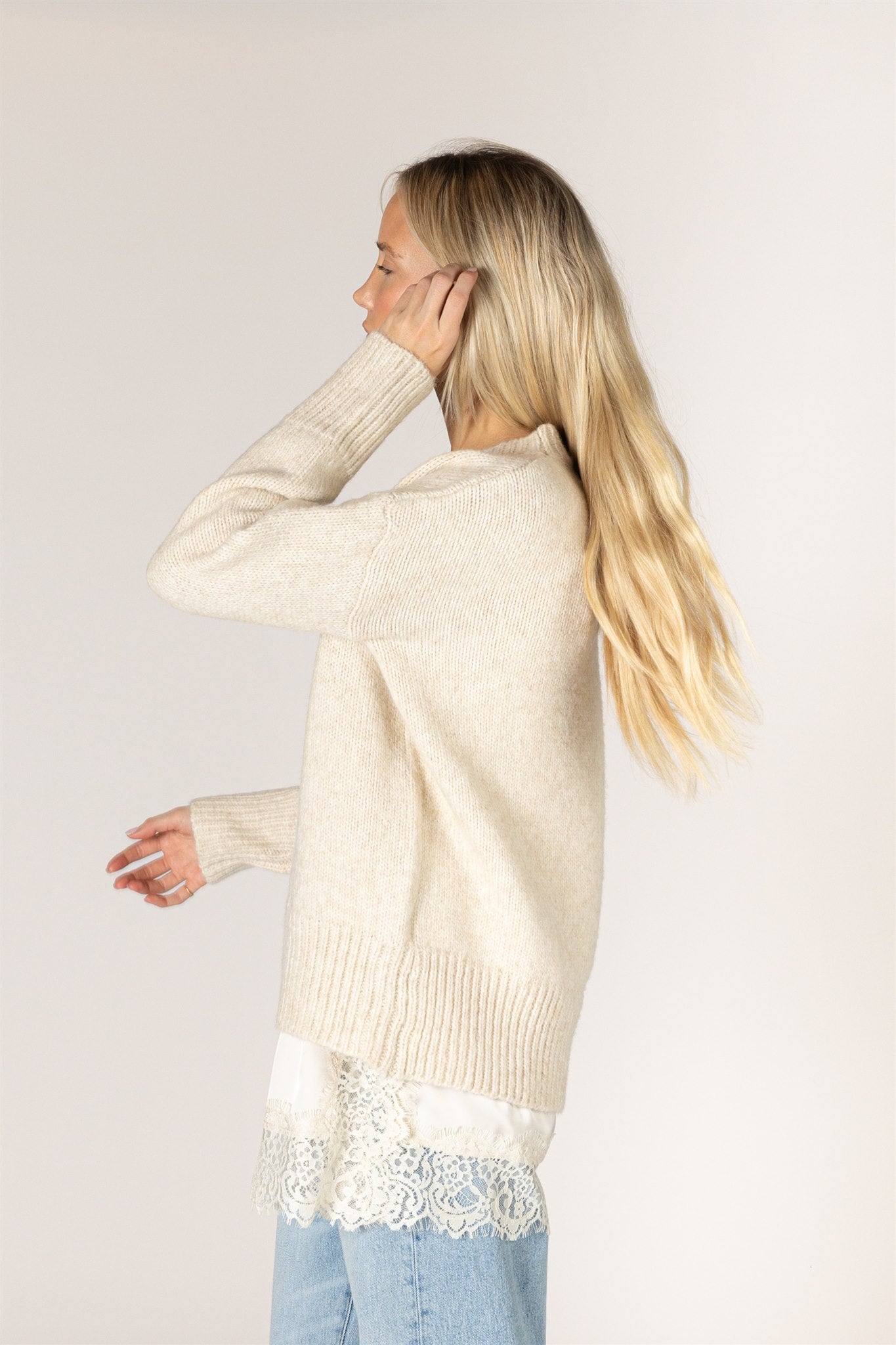 Pumice-colored Tanya sweater in a relaxed knit, featuring a classic crew neckline, dropped shoulders, long sleeves, and chunky ribbed trim at the neckline, cuffs, and hem.