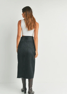 Just Black Denim Midi Skirt. HIGH RISE DENIM MIDI SKIRT WITH RELAXED FIT AND FRONT SLIT IN LIGHT WASH DENIM.