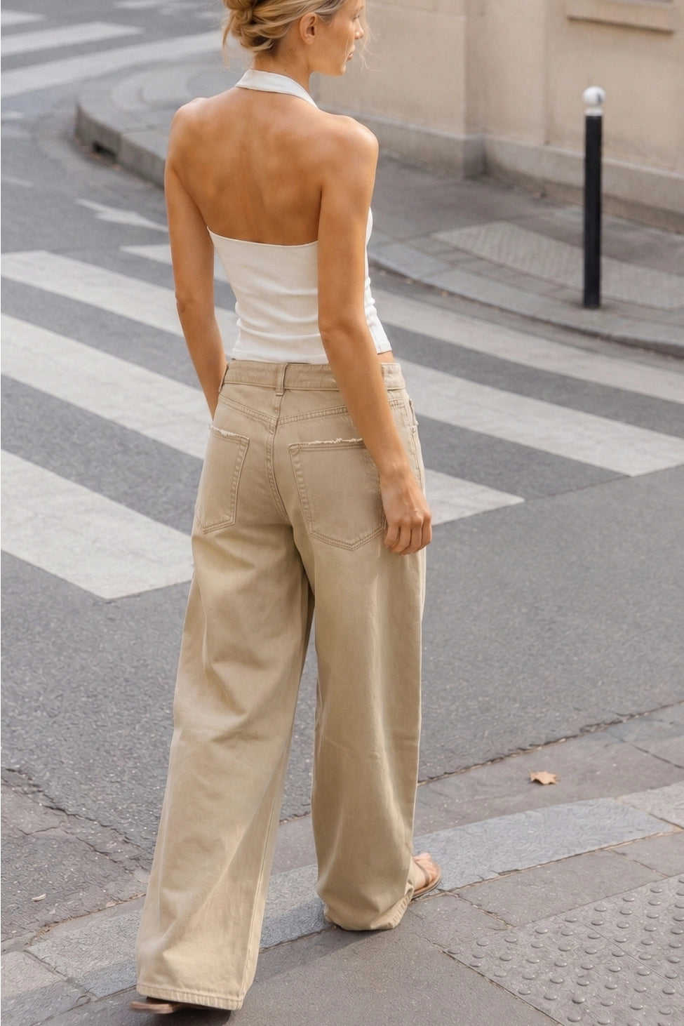 The Celine Folded-Waist Jeans in a soft sand wash, featuring a relaxed baggy wide-leg fit, folded waist detail, and subtle distressed accents.
