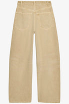 The Celine Folded-Waist Jeans in a soft sand wash, featuring a relaxed baggy wide-leg fit, folded waist detail, and subtle distressed accents.
