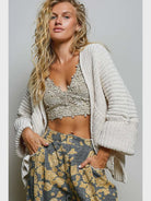 Noemi Cardi in Cream featuring a chunky textured knit, relaxed oversized fit, open front, long sleeves, and side pockets.