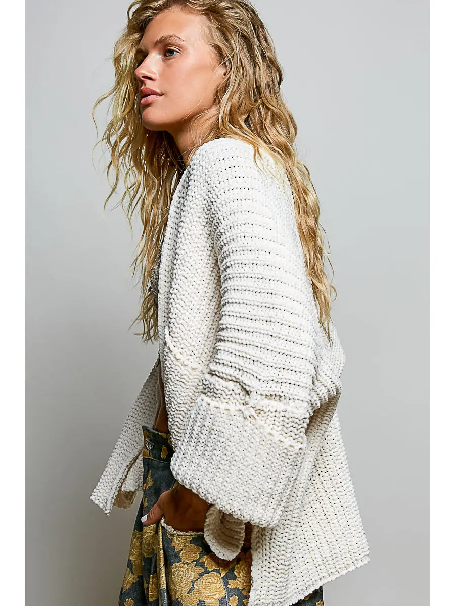 Noemi Cardi in Cream featuring a chunky textured knit, relaxed oversized fit, open front, long sleeves, and side pockets.