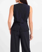 The Sadie &amp; Sage East Gate Pinstripe Waistcoat brings a polished, modern feel to classic tailoring. Designed with a structured silhouette and timeless pinstripe pattern, this versatile vest is perfect for dressing up or styling more casually. Pair it with the matching East Gate Pinstripe Pants for a chic, coordinated set