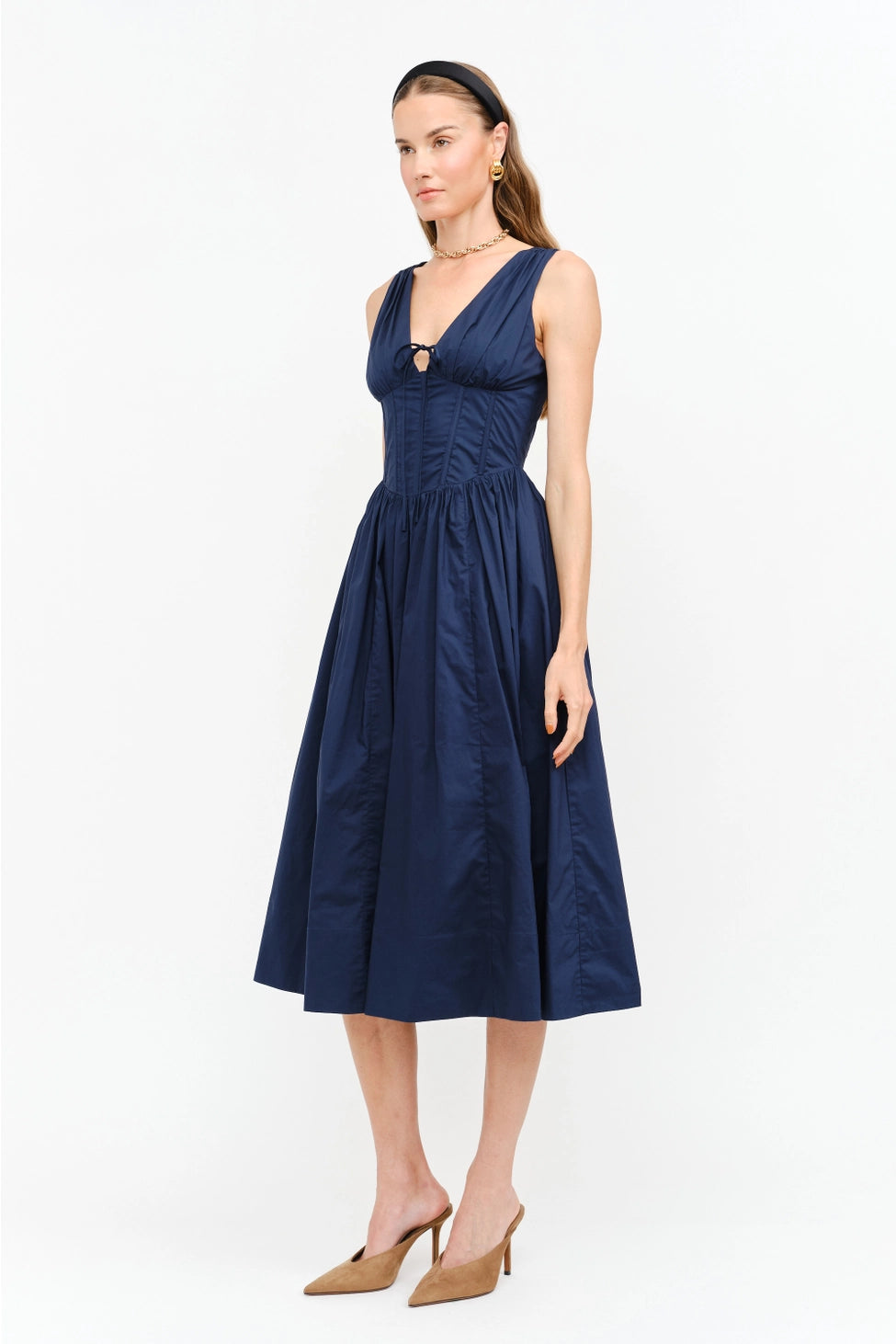 Shae Poplin Midi Dress in navy featuring a corset-inspired fitted bodice, plunging V-neckline, gathered bust with tie-front detail, defined waist, and full midi-length skirt.