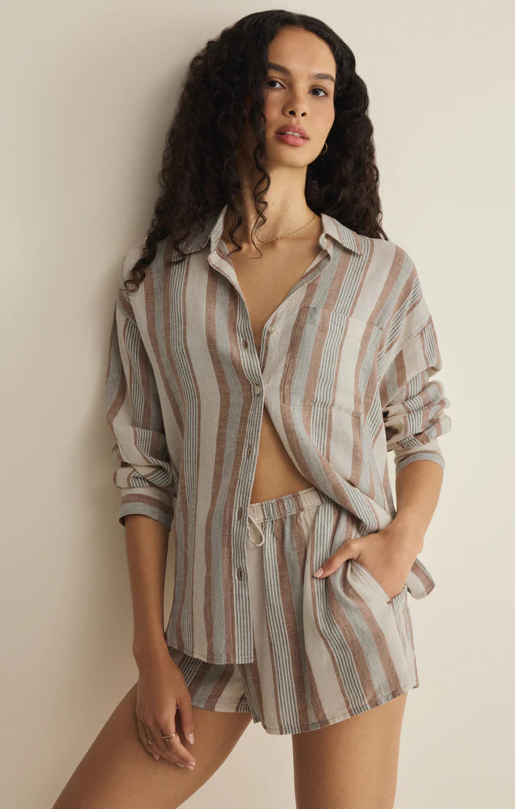 Woman wearing a neutral striped shirt and shorts set. Female Clothing Store Ontario Small Business