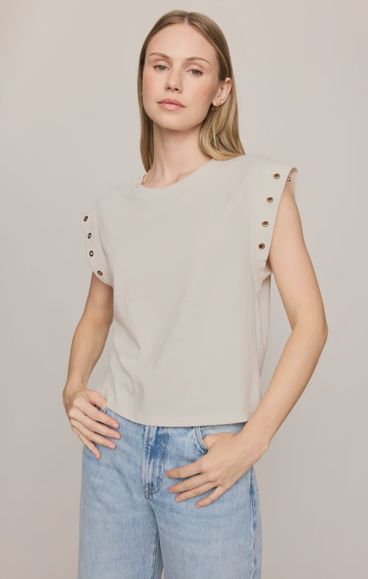 Relaxed muscle tee in soft cotton-blend jersey with gold metal grommet details at the arm openings. An elevated everyday basic with an effortless drape and versatile, modern silhouette.