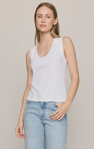 Model wearing the Z Supply Ellie V-Neck Tank, a sleeveless ribbed cotton tank featuring a flattering V-neckline, wide bra-friendly straps, and a fitted silhouette. The versatile essential is styled with casual bottoms for an effortless everyday look.
