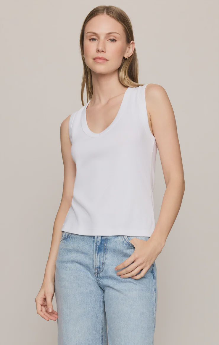 Model wearing the Z Supply Ellie V-Neck Tank, a sleeveless ribbed cotton tank featuring a flattering V-neckline, wide bra-friendly straps, and a fitted silhouette. The versatile essential is styled with casual bottoms for an effortless everyday look.