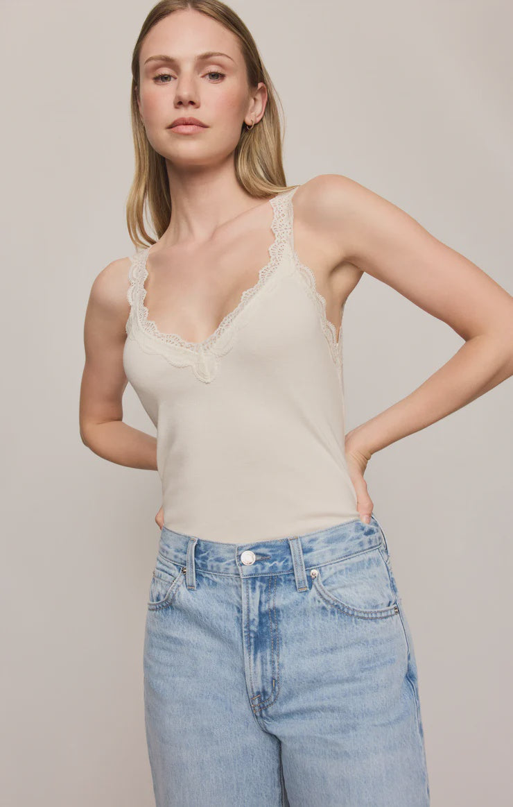 Fitted baby rib cotton tank with a lace-trimmed V-neckline and wide straps. A soft, feminine essential that's perfect for layering or wearing on its own.