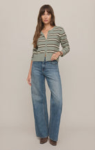 Striped knit cardigan featuring a crew neckline, button-front closure, long sleeves, and a lightweight, regular fit in a sage green base with cream and brown stripes.
