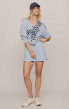 Soft baby French terry shorts featuring a high-rise fit, elastic waistband, sporty dolphin hem, and side seam pockets. Designed in a relaxed silhouette for comfortable everyday wear.