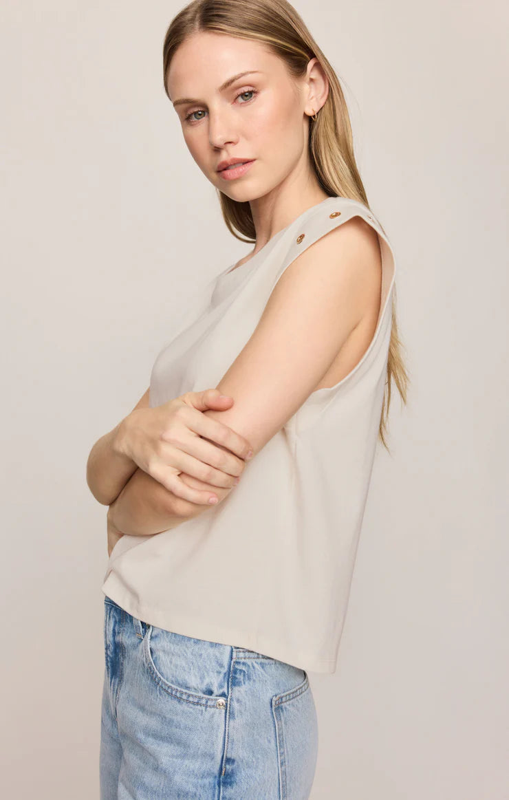 Relaxed muscle tee in soft cotton-blend jersey with gold metal grommet details at the arm openings. An elevated everyday basic with an effortless drape and versatile, modern silhouette.