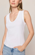 Model wearing the Z Supply Ellie V-Neck Tank, a sleeveless ribbed cotton tank featuring a flattering V-neckline, wide bra-friendly straps, and a fitted silhouette. The versatile essential is styled with casual bottoms for an effortless everyday look.