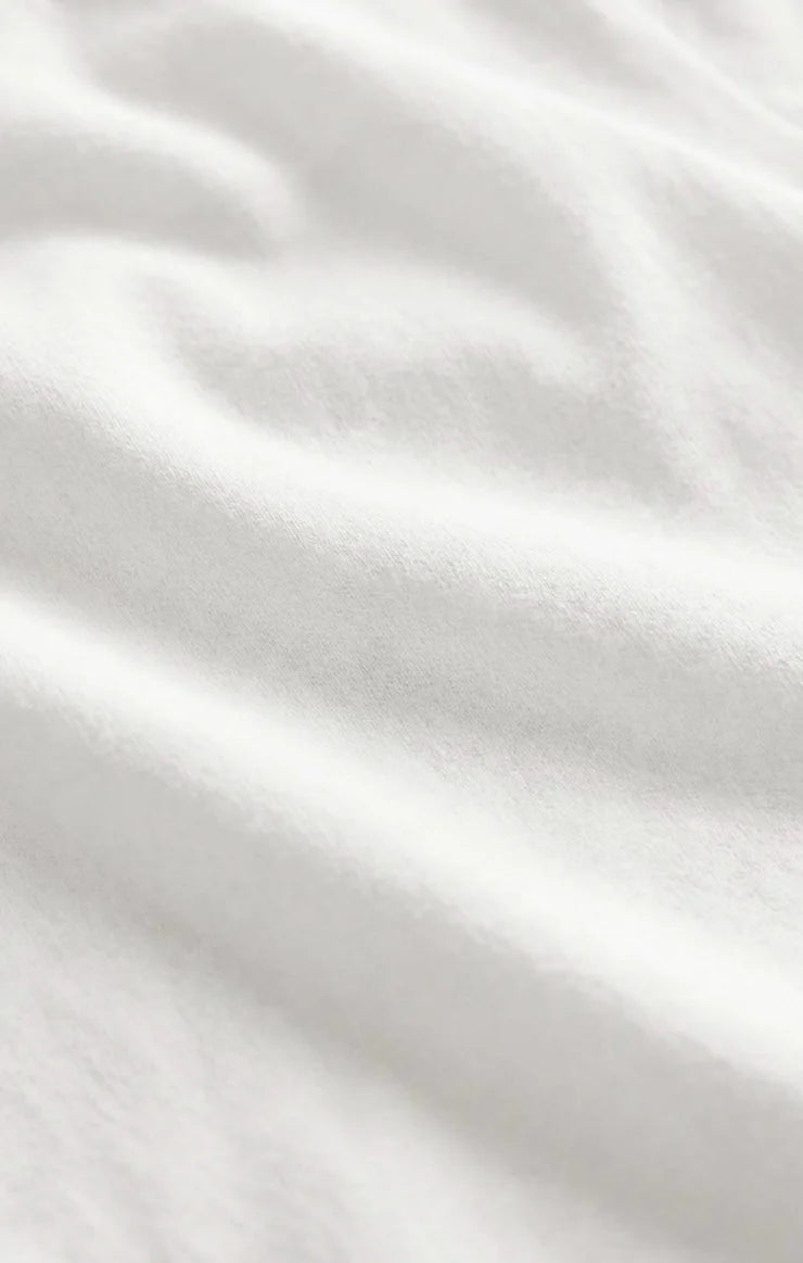 Close-up of the Z Supply Ellie V-Neck Tank's soft 100% cotton baby rib fabric, highlighting its fine ribbed texture, smooth finish, and comfortable stretch with a substantial yet breathable feel.
