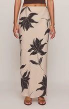Straight floral midi skirt in a lightweight textured rayon blend with a comfortable elastic waistband. An easy, versatile piece with a timeless print and effortless drape.