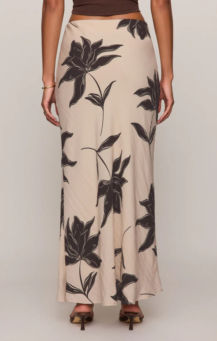 Straight floral midi skirt in a lightweight textured rayon blend with a comfortable elastic waistband. An easy, versatile piece with a timeless print and effortless drape.