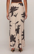 Straight floral midi skirt in a lightweight textured rayon blend with a comfortable elastic waistband. An easy, versatile piece with a timeless print and effortless drape.
