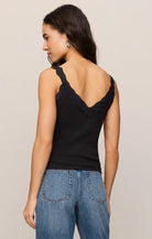 Fitted baby rib cotton tank with a lace-trimmed V-neckline and wide straps. A soft, feminine essential that's perfect for layering or wearing on its own.