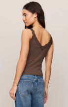 Fitted baby rib cotton tank with a lace-trimmed V-neckline and wide straps. A soft, feminine essential that's perfect for layering or wearing on its own.