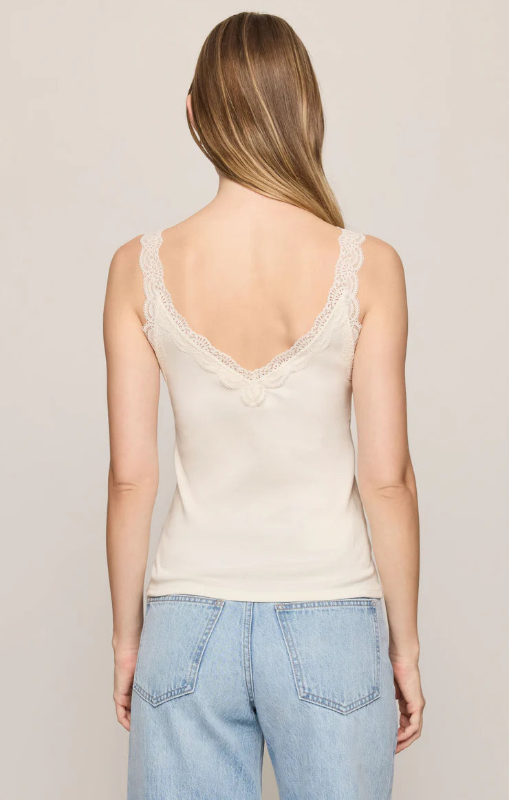 Fitted baby rib cotton tank with a lace-trimmed V-neckline and wide straps. A soft, feminine essential that's perfect for layering or wearing on its own.