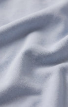 Close-up of the baby French terry fabric, showcasing its soft cotton-blend texture with a smooth exterior and plush looped interior for lightweight comfort.