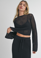 Miou Muse Crochet Top. Cropped black knitted top, this top matches perfectly with our Miou Muse Crochet Skirt perfect for Beach/Summer lovers. Use as a swimsuit coverup or for casual wear. Pair with a cute pair of sandals and sneakers for a classy casual summer look. 
