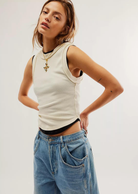 Free People Kate Tee- Ivory The ideal tank-inspired top, this sleeveless tee is featured in an effortless, goes-with-anything design with rounded bottom hem and exposed seaming for a true lived-in look.