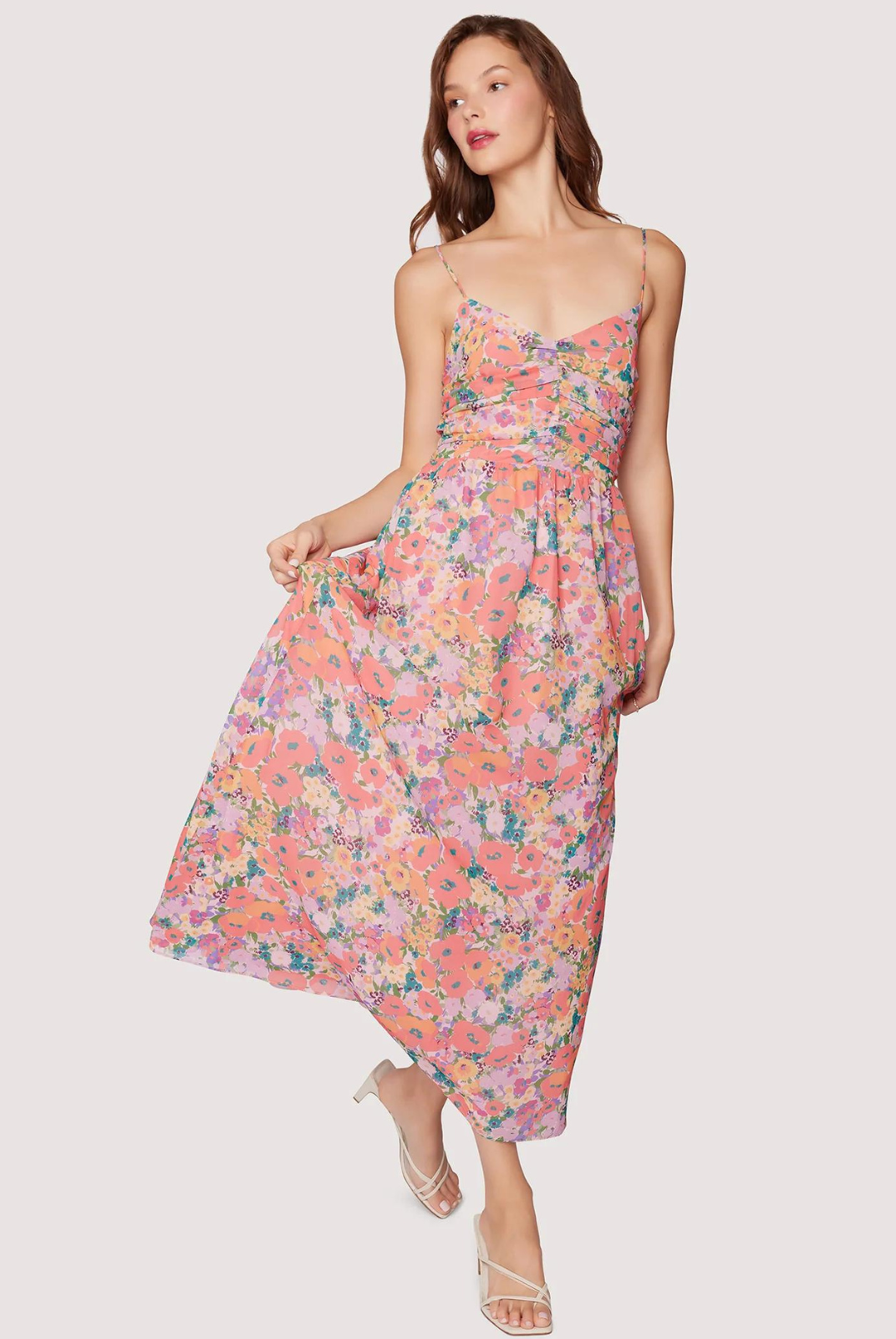 Lost + Wander Floral Bliss Maxi Dress. The Floral Bliss Maxi Dress is perfect for your spring events. With its beautiful floral chiffon print in a pink-peach tone, it exudes a flowy and feminine vibe. Don't worry about forgetting your essentials, as this dress also has a hidden side pocket. The adjustable spaghetti straps allow for a perfect fit.