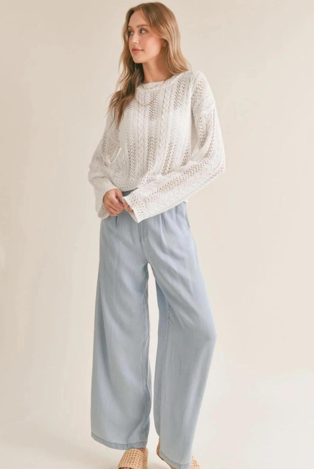 Sadie & Sage Ella Cable Knit Sweater. Elevate your spring wardrobe with our Ella Cable Knit Sweater! Featuring a classic cable knit design and lightweight fabric, this long sleeve sweater in white is perfect for layering and keeping you warm without weighing you down.